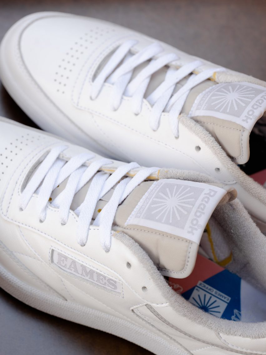 A pair of white Reebok x Eames trainers
