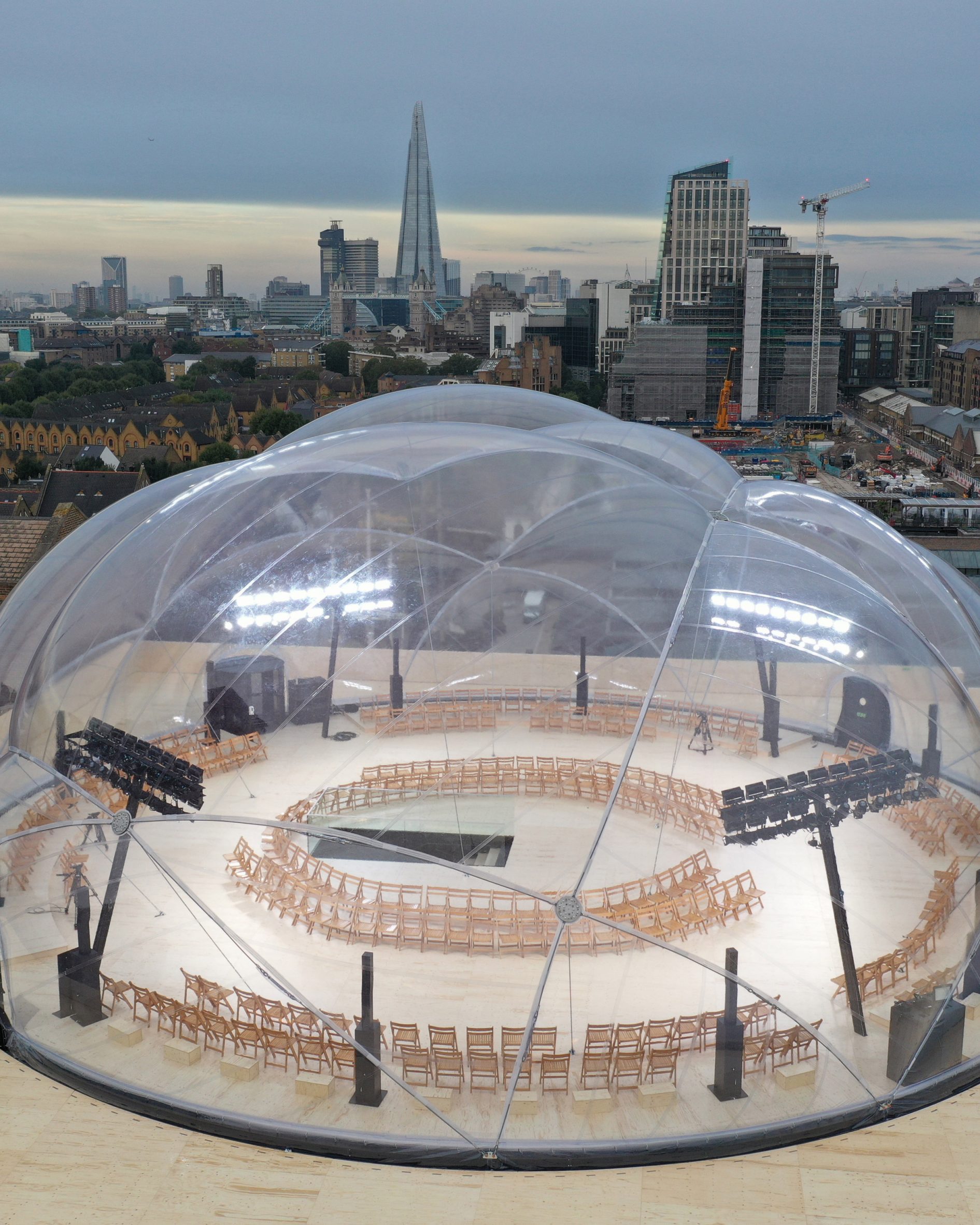 The alexander mcqueen show space by Smiljan radic is pictured against the london skyline