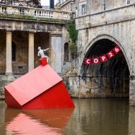 Stride Treglown places "sinking" Monopoly-style house in River Avon ahead of COP26