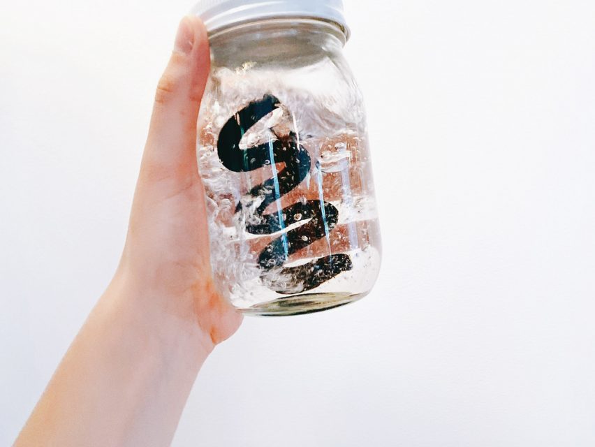 Strøm water purifying stick in a glass jar