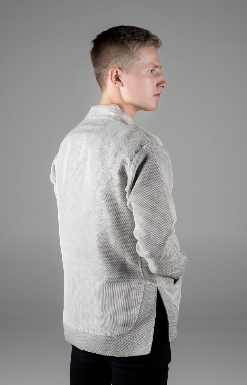 Man in light grey solar-powered textile jacket from the back
