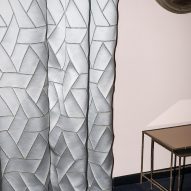Dedar's Intarsiato fabric in silver being used as curtains