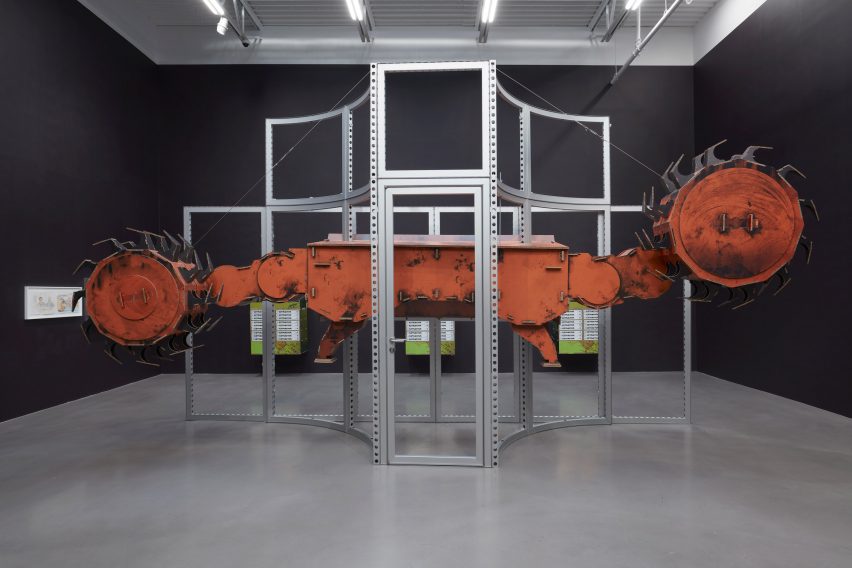 Simon Denny's industrial machinery artwork in a gallery
