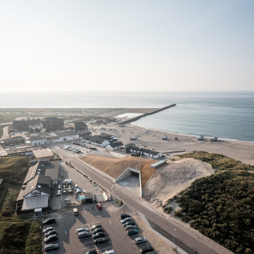 An visitor centre embedded in a dune landscape