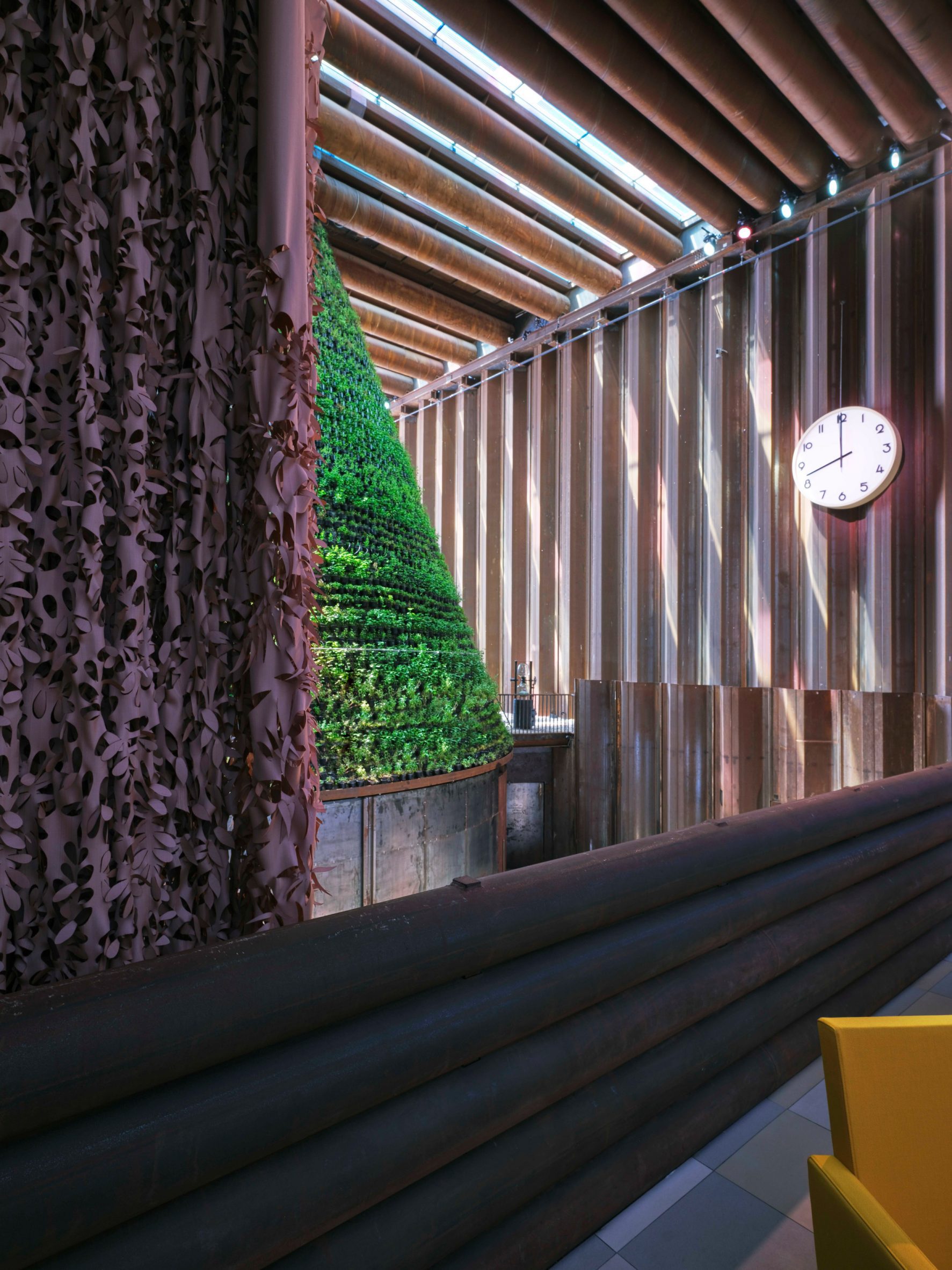 A curtain made of bio-based textile partitions the VIP lounge from the Dutch Biotope pavilion exhibition space