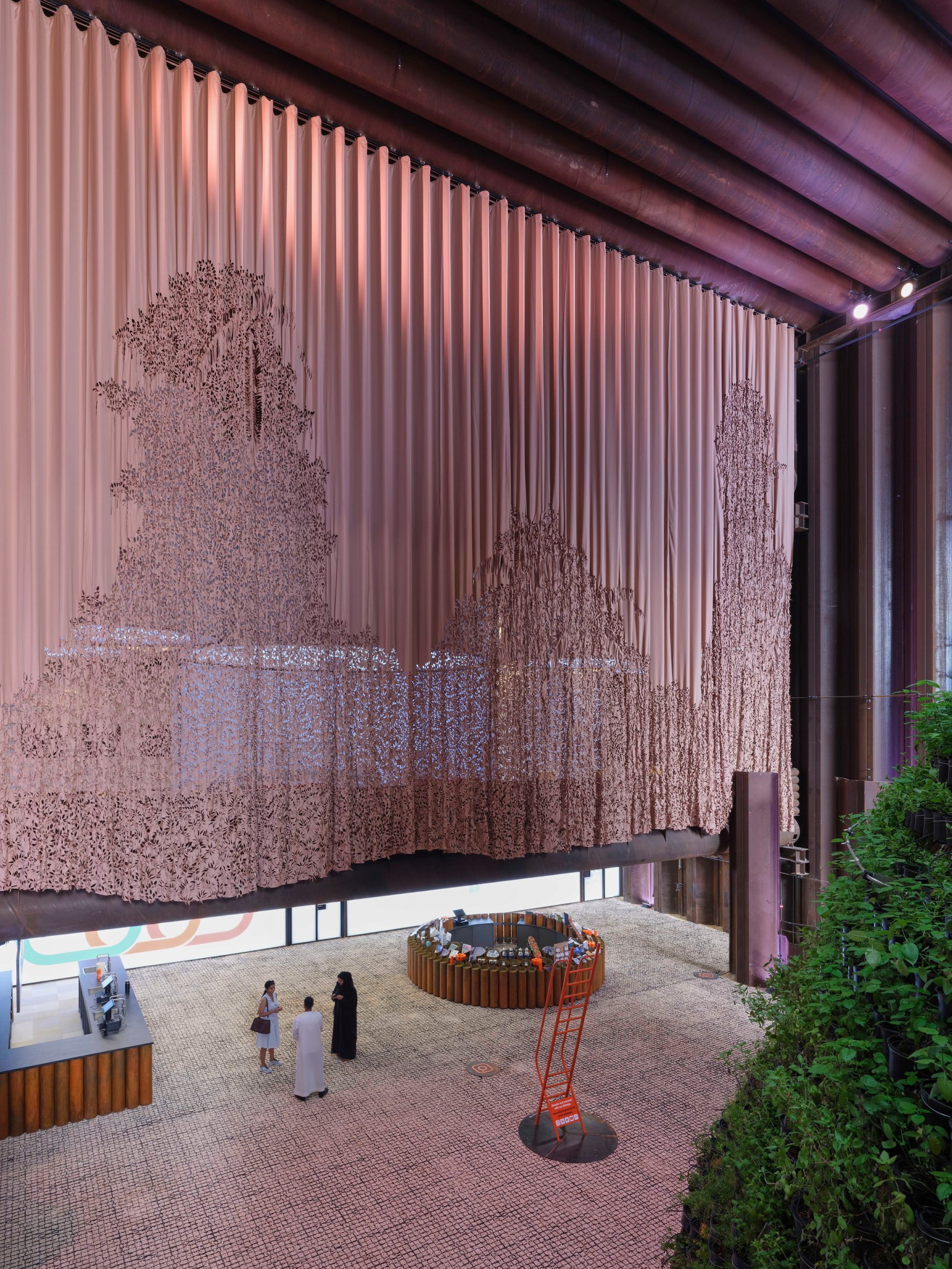 Beige patterned curtain divides exhibition space in the Dutch Biotope pavilion