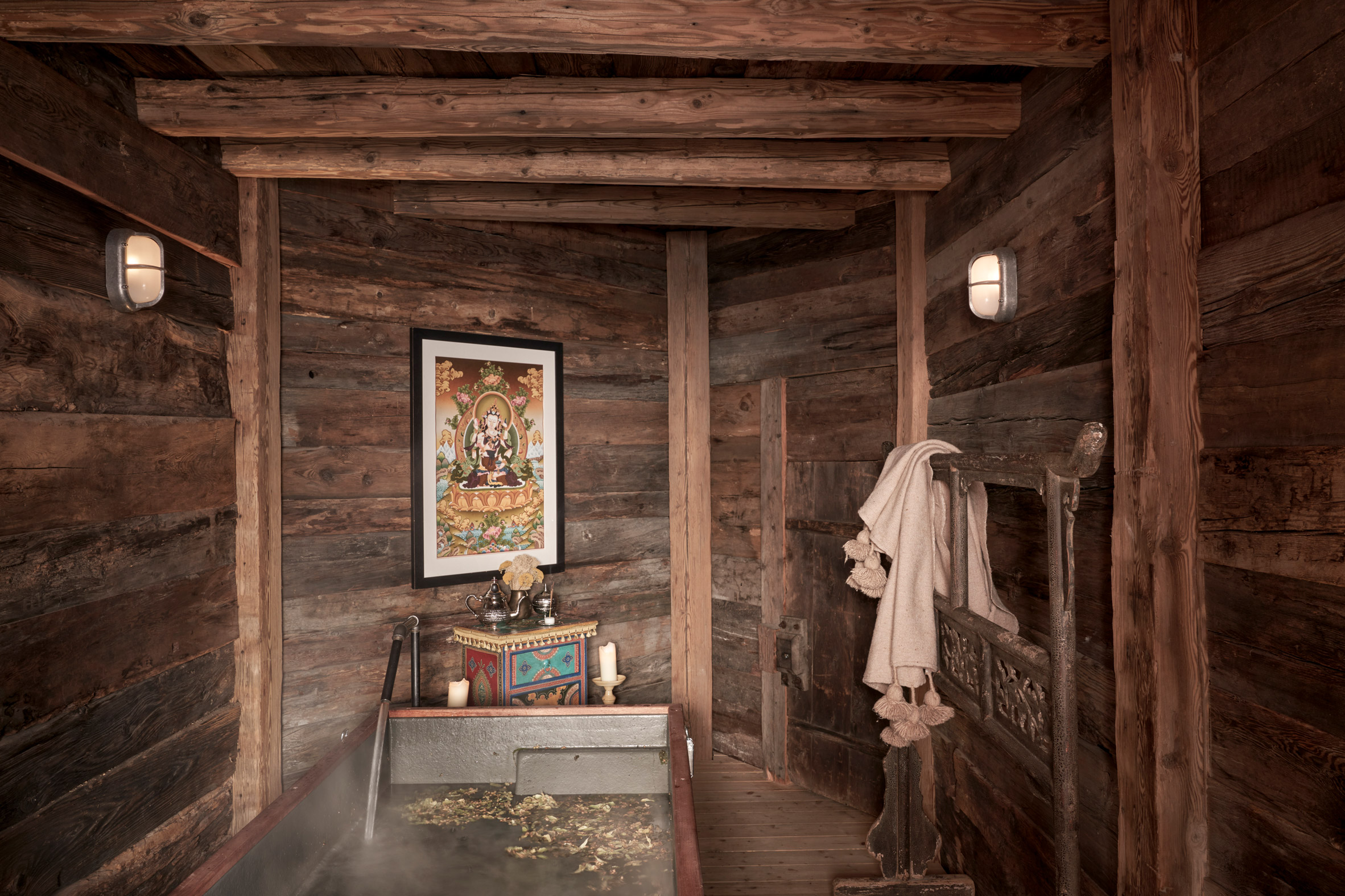 A photograph of a bathroom clad in wood at The CERVO Mountain Resort