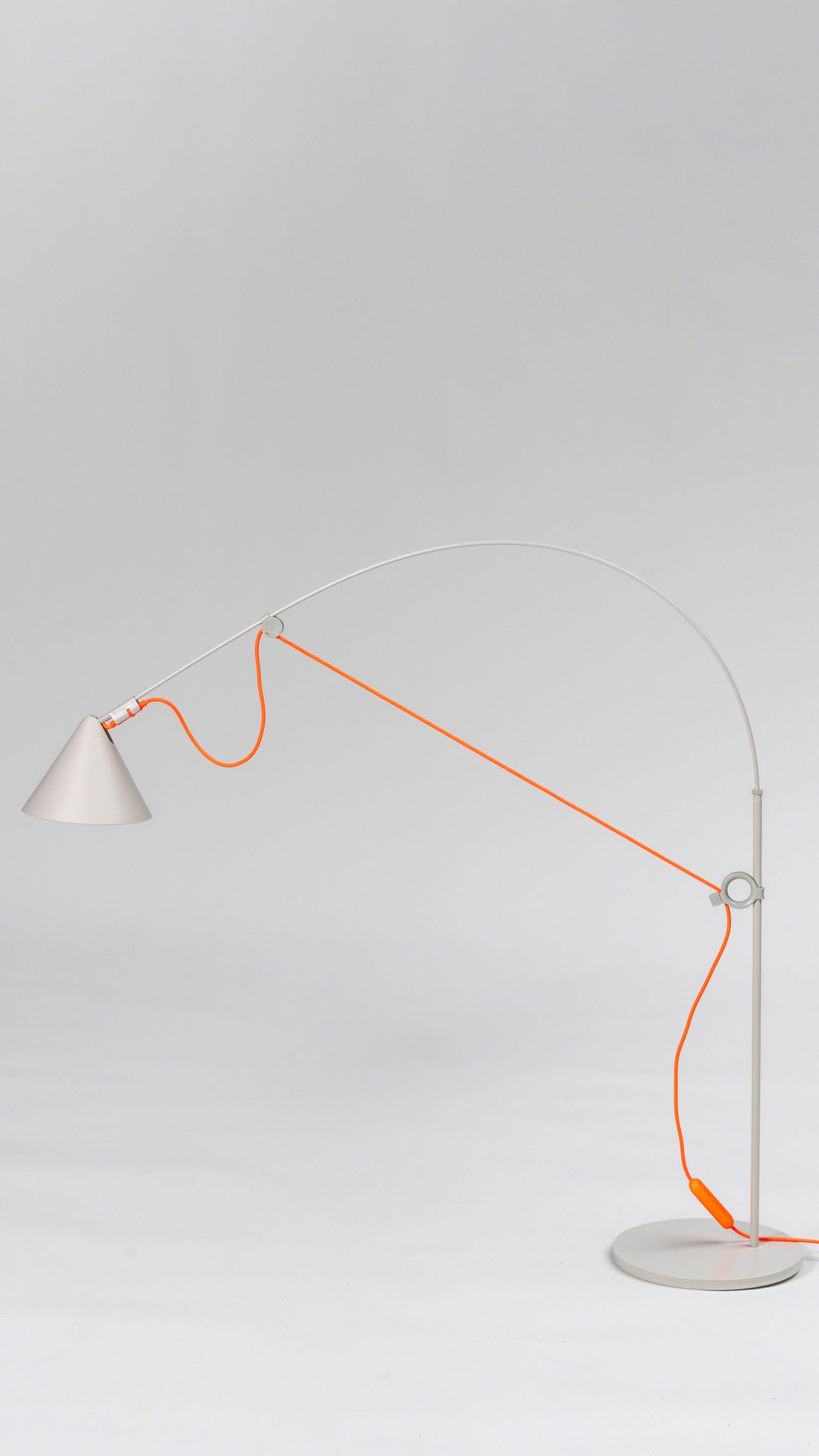 Ayno lighting collection by Stefan Diez for Midgard in Silk Grey with an orange cable