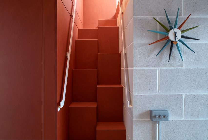 Orange staircase in Catching Sun House