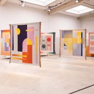 Colourful tapestries hanging in an exhibition