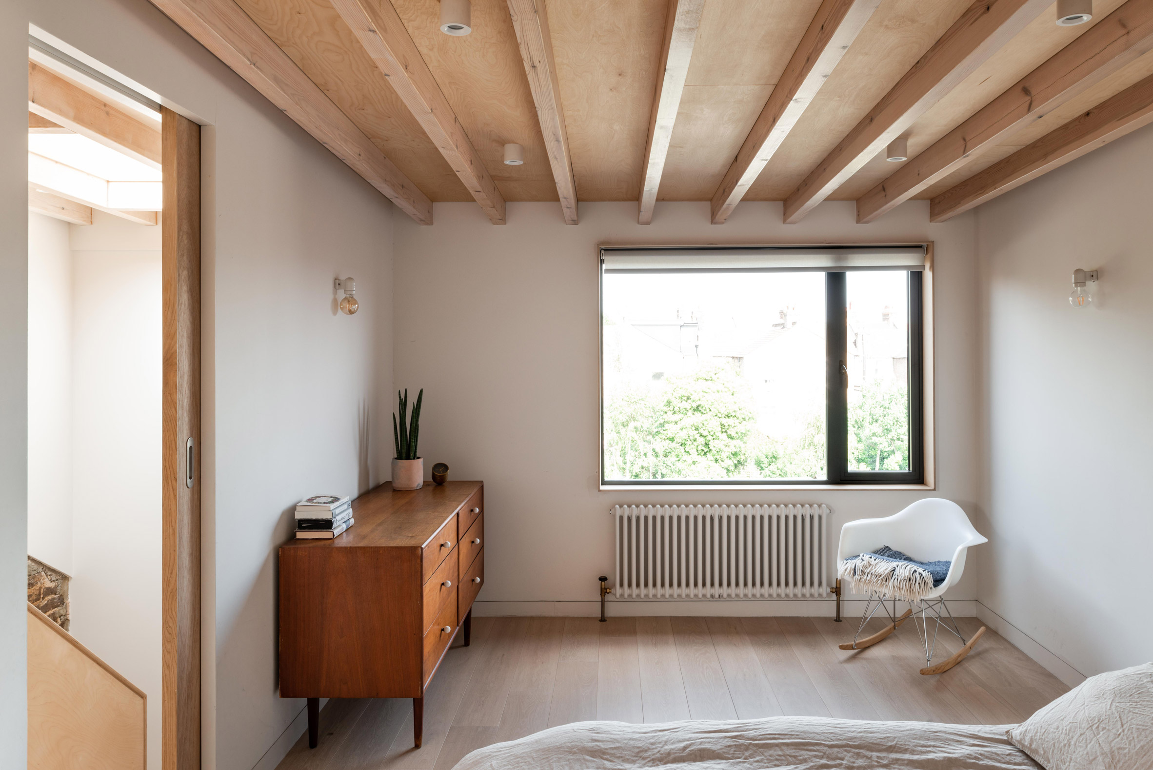 Bedroom with exposed wood ceiling
