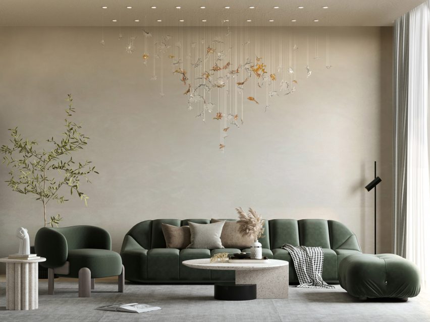 Lasvit's Dancing Leaves glass lighting sculpture in light amber and clear suspended in a residential living room interior