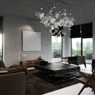 Lasvit's Dancing Leaves lighting sculpture in clear glass hanging in a contemporary living room interior