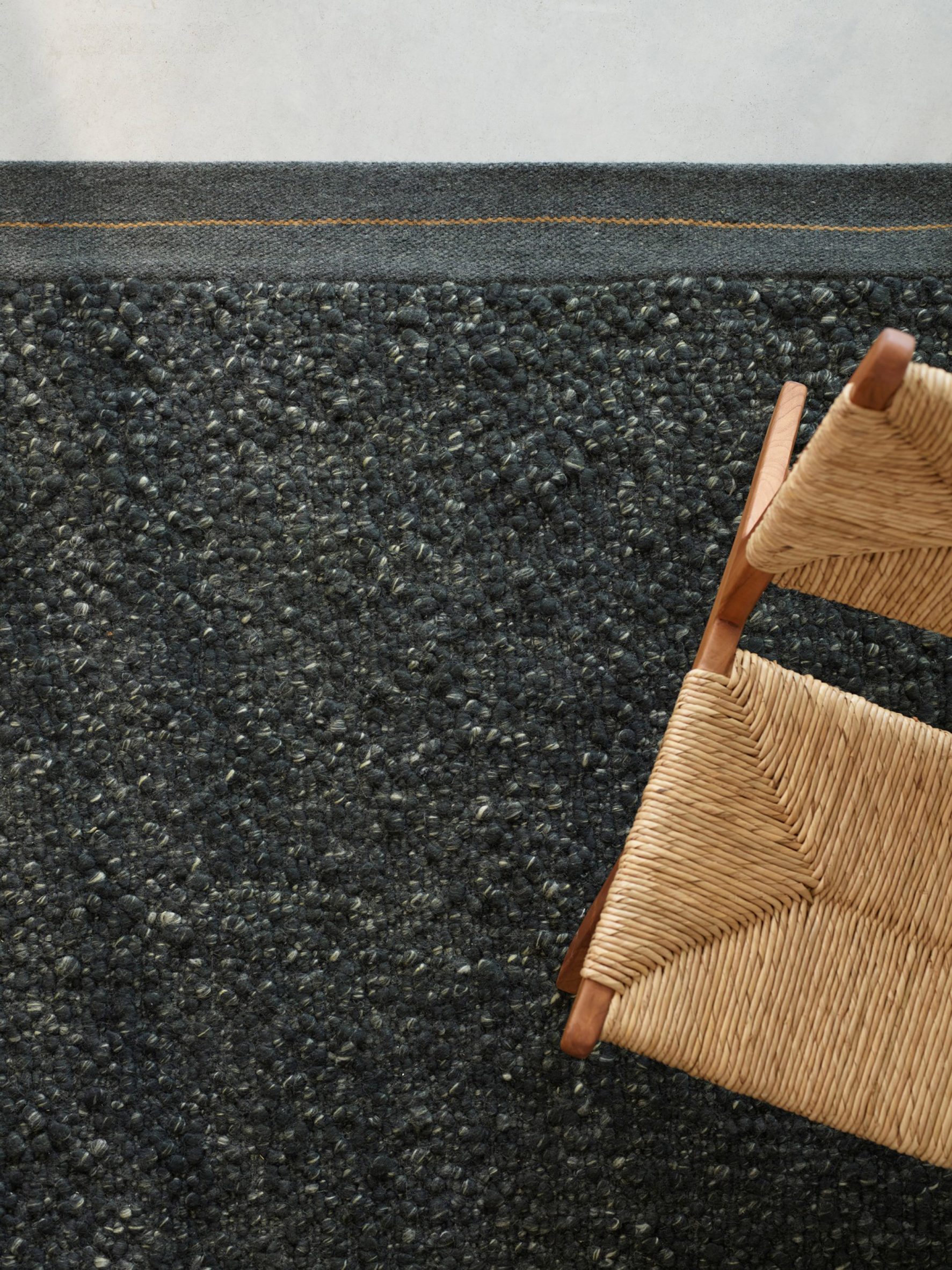 A black marled wool rug