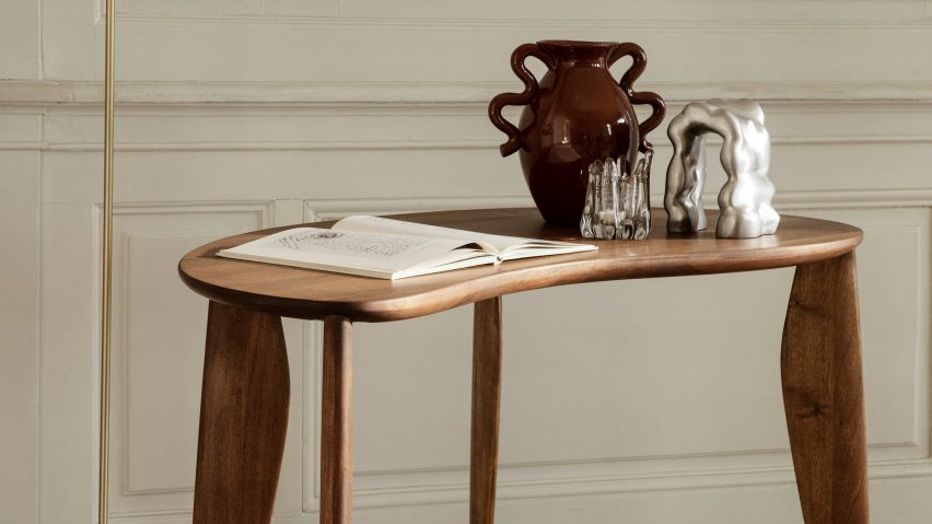 A photograph of a desk in walnut brown