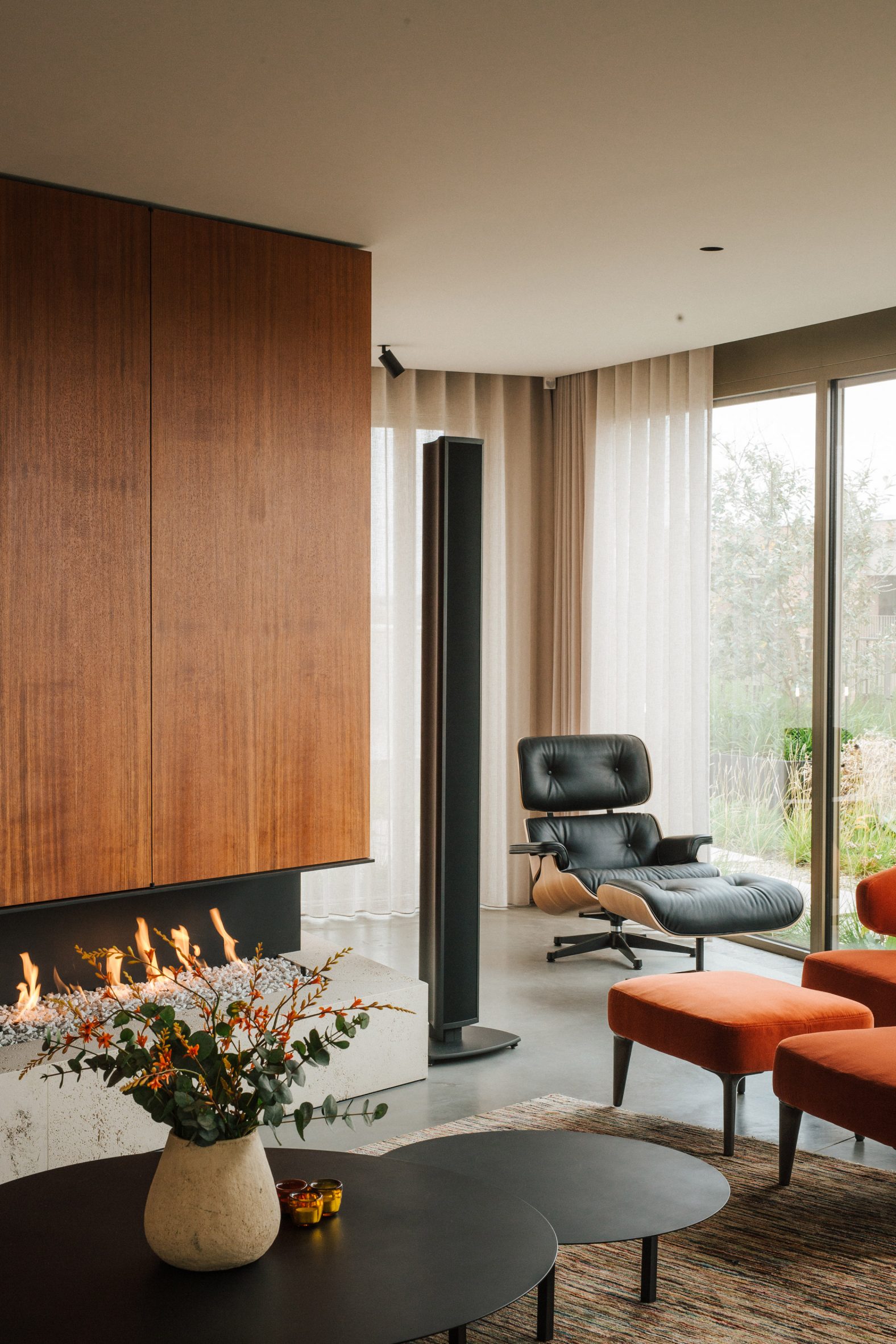 A fireplace was clad in cherry wood veneer in this penthouse