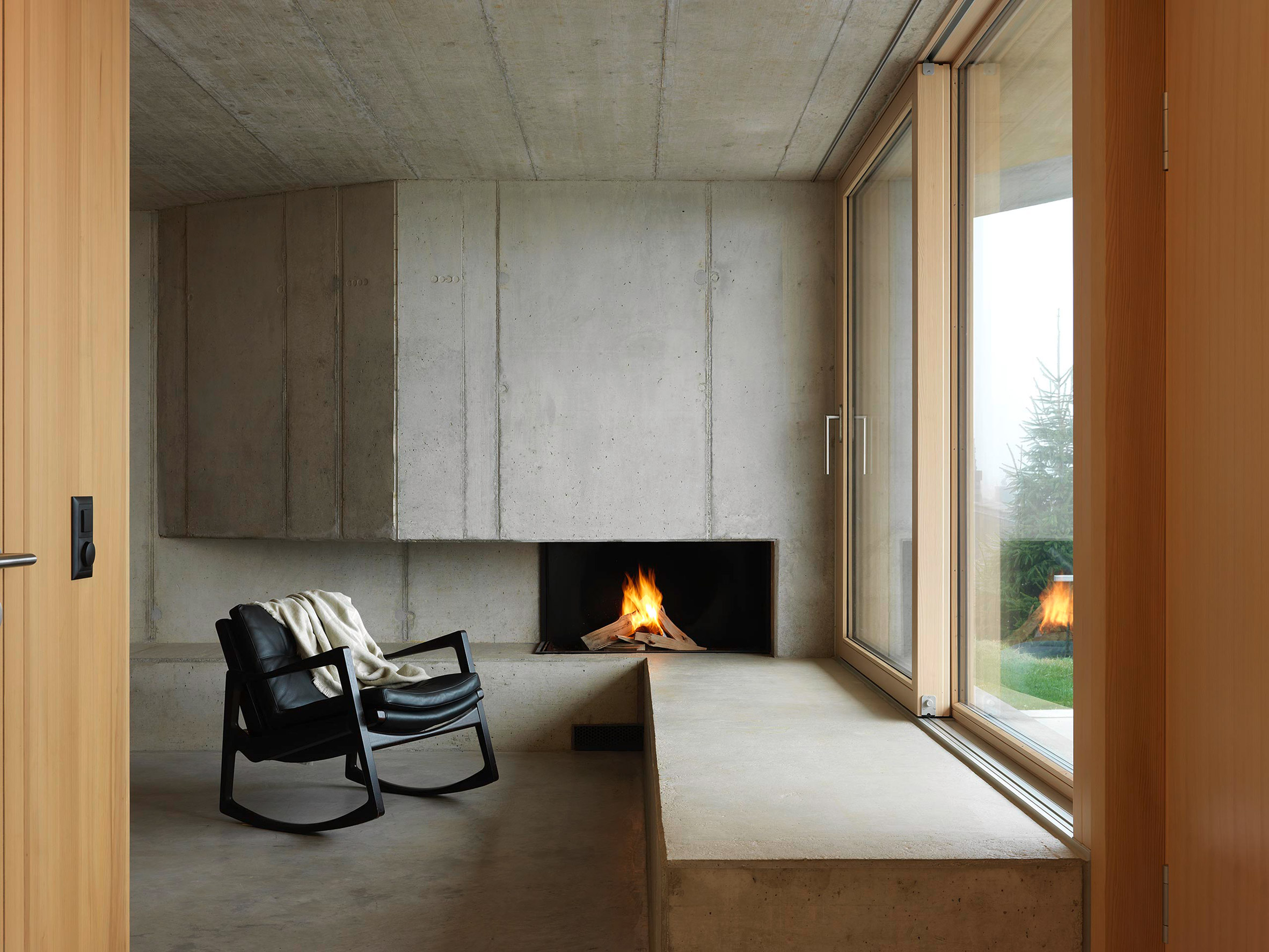 Concrete interiors with built in fireplace