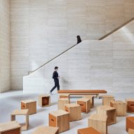Foster + Partners flanks Istanbul Apple Store with travertine stone walls