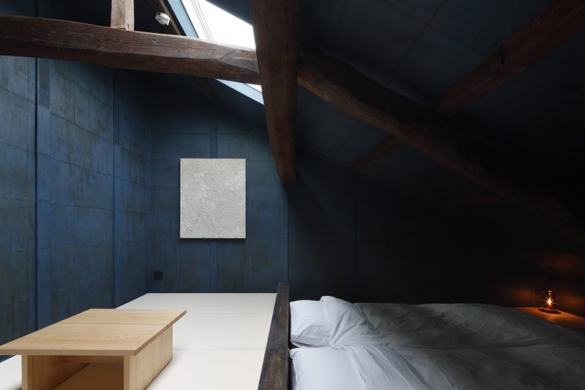 Walls of a guest room at Hishiya restaurant and guesthouse were painted dark blue