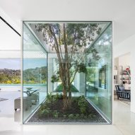 White stucco wraps Getty View Residence by Abramson Architects in Los Angeles