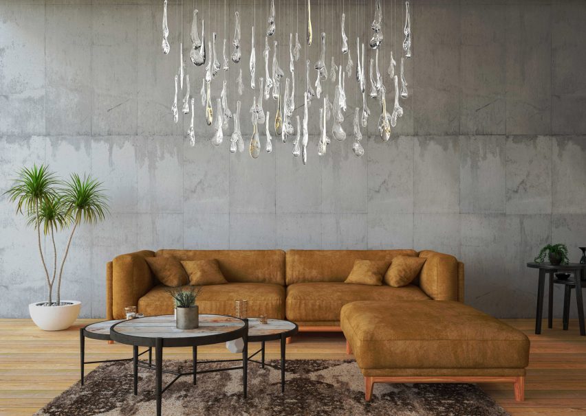 Glass lighting installation by Maria Culenova hanging over a brown sofa in a living room