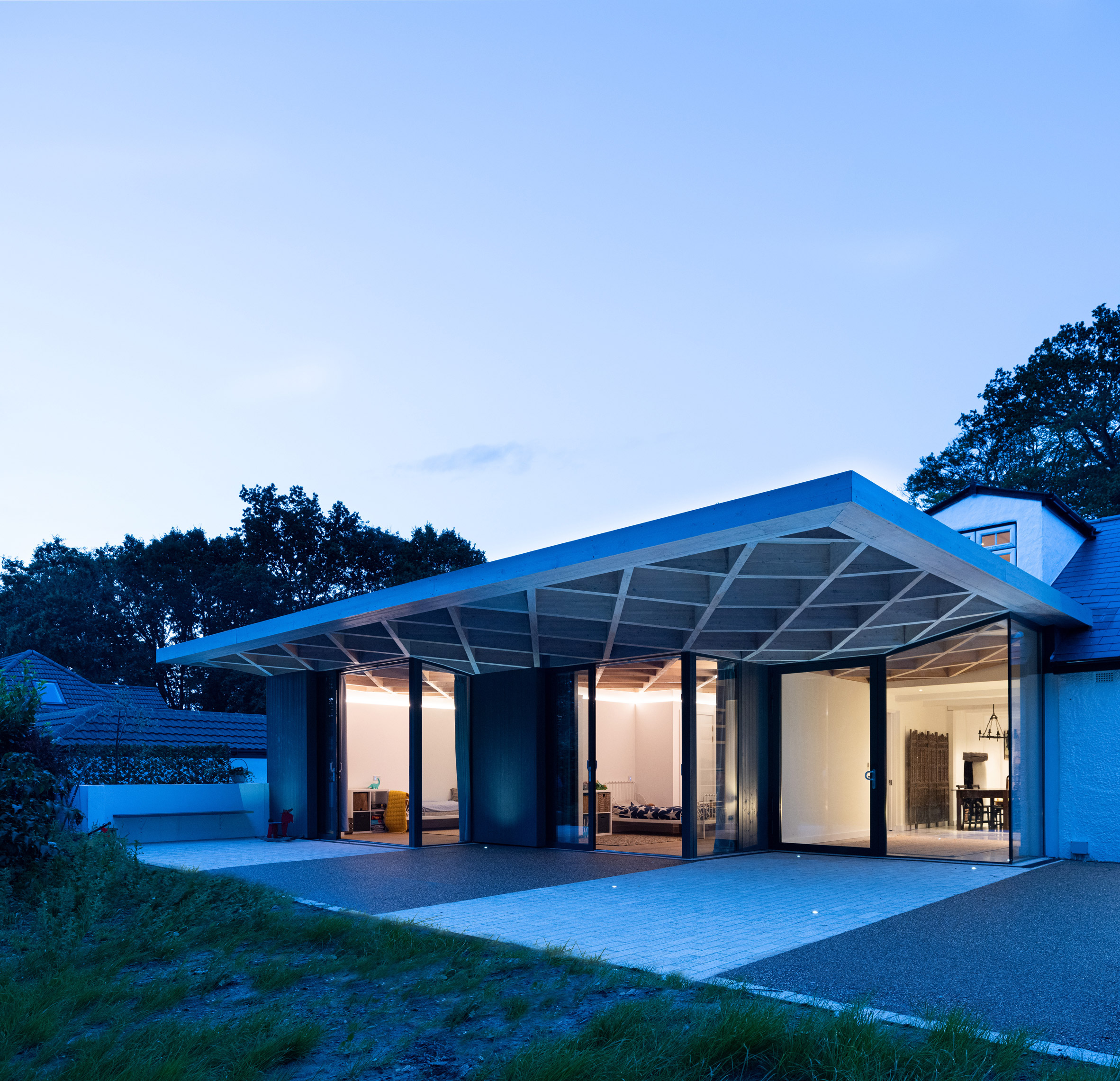 Night view of House for Theo and Oskar by Tigg + Coll