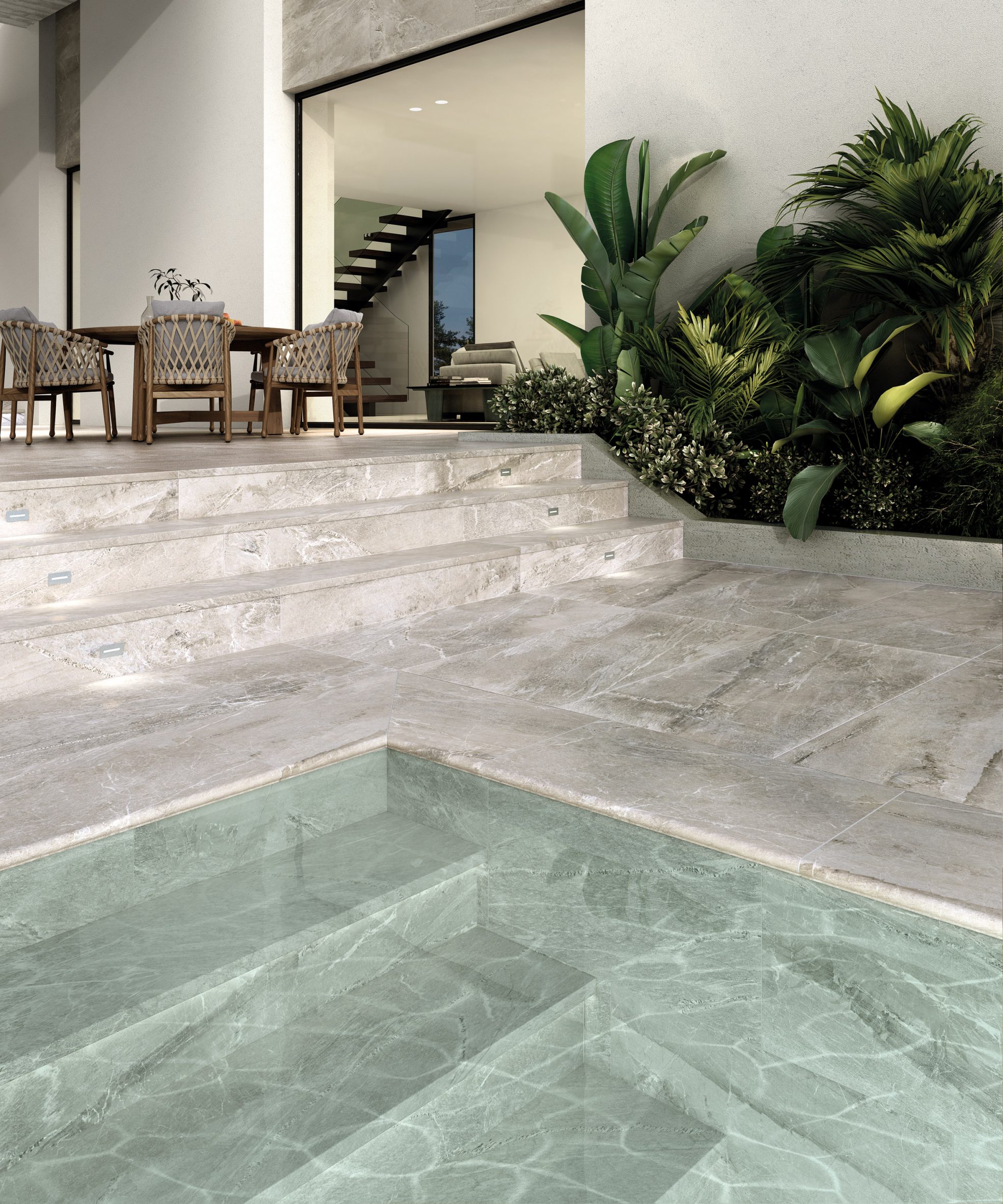 Exagres' Imperial porcelain tiles used as flooring and stairs for an outdoor swimming pool