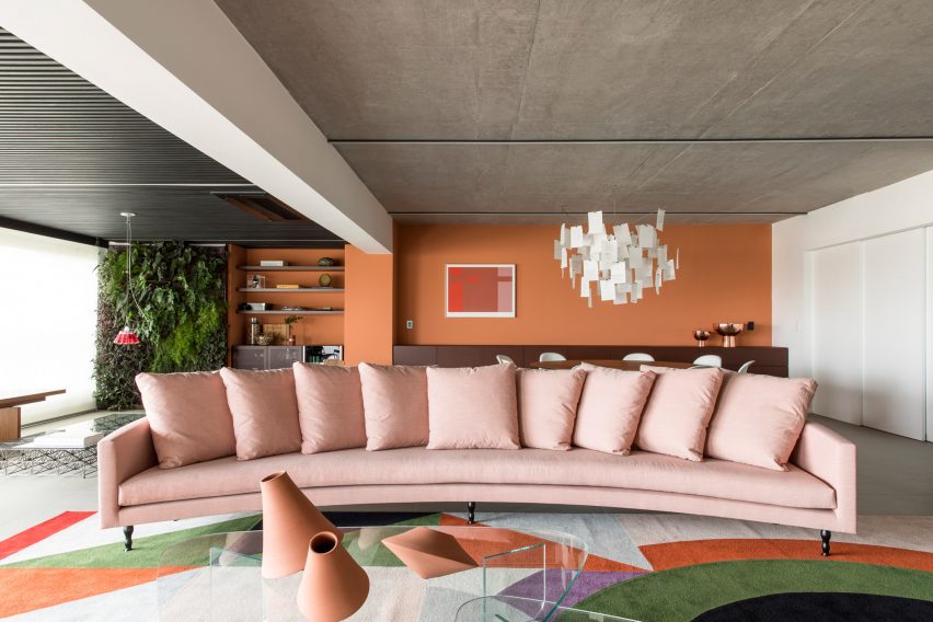 Crescent-shaped pink sofa