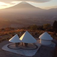 Kengo Kuma adds mountain-shaped toilets to hiking trail overlooking Mount Fuji