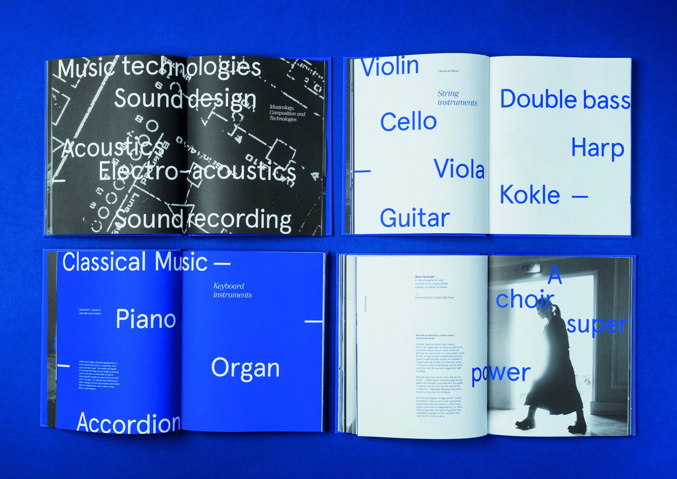 Double-page spreads in black, white and blue in the 100 Years of the Latvian Academy of Music publication