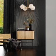 Luce tiles in black for the floor and walls of a living room interior