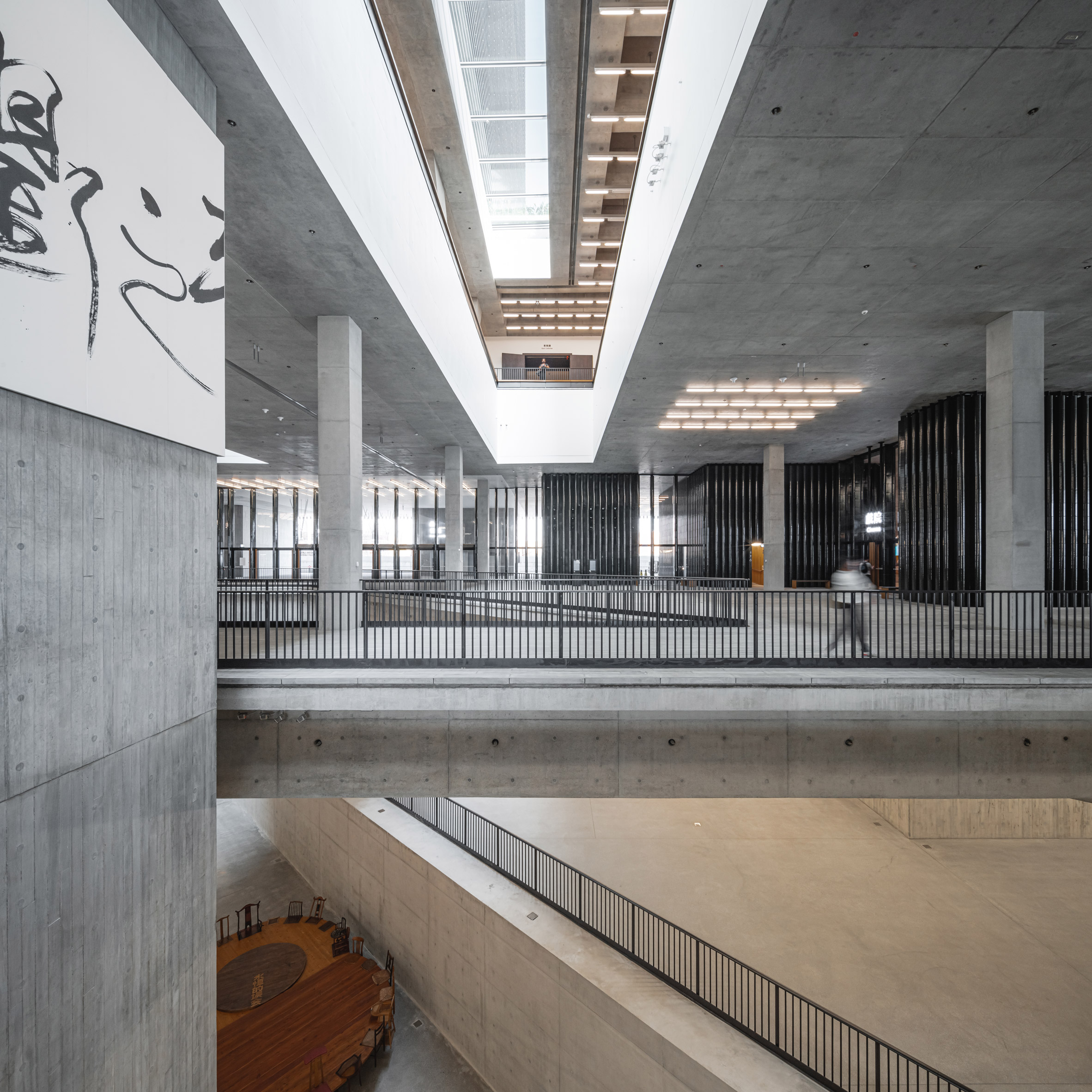 Main Hall of the M+ Museum, with lightwell above and cutaways to the Found Space below