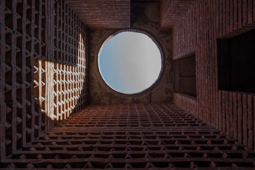 Round skylight at the top of a brick lightwell inside the Bait Ur Rouf Mosque 
