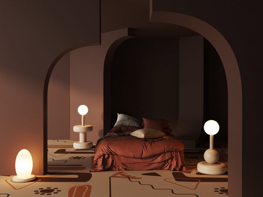 Karpet Pengrajin Moche berwarna hangat dari Talk Carpet digunakan di kamar tidur dengan pencahayaan redup