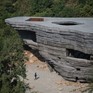 Open Architecture unveils rock-like concert hall in a valley outside Beijing