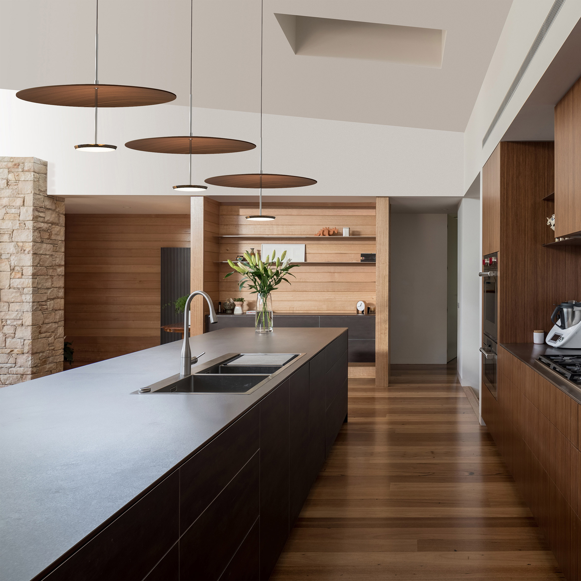 Pablo Design's Sky Dome pendant lights suspended in a contemporary kitchen interior