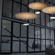 Pablo Design's Sky Dome pendant lights suspended in a living room interior