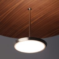 Close up of Pablo Design's Sky Dome pendant light with a pressed wood shade