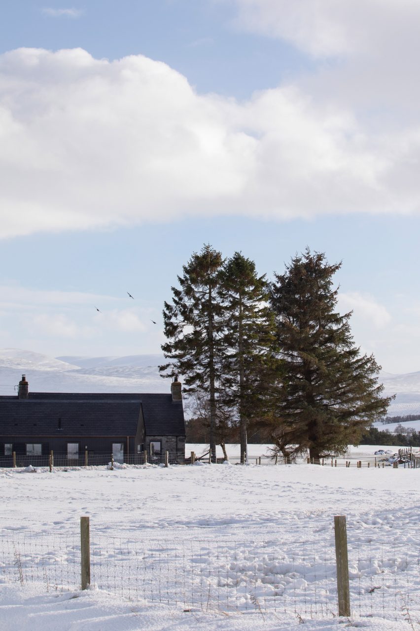 A cottage in a snowy field