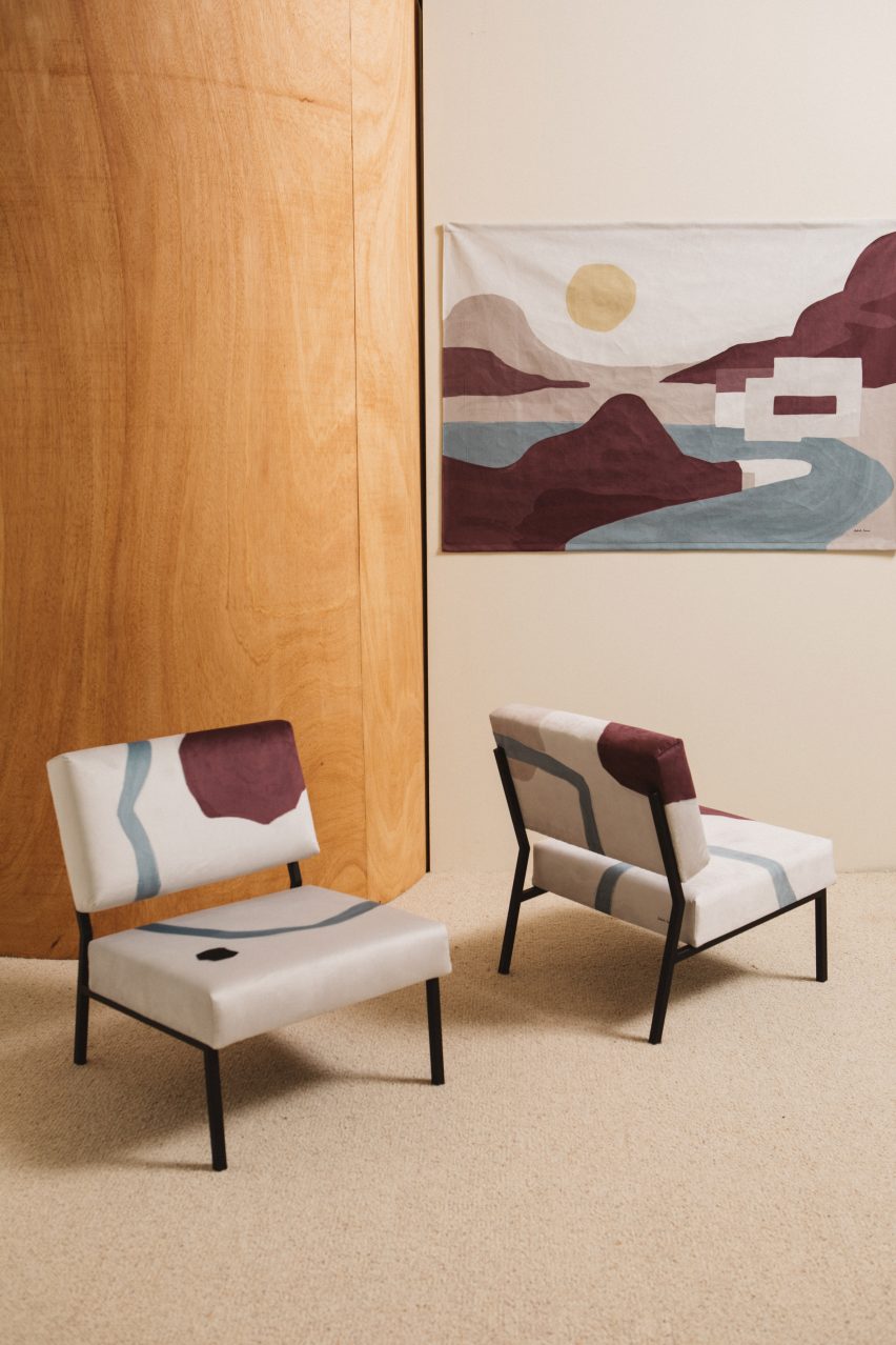A photograph of two Armchair 02 chairs with matching wall hanging