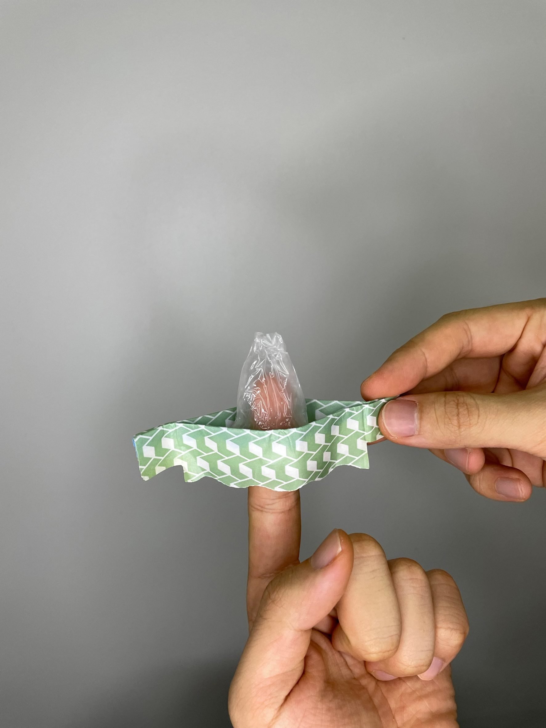 A finger inside the Wondaleaf unisex condom