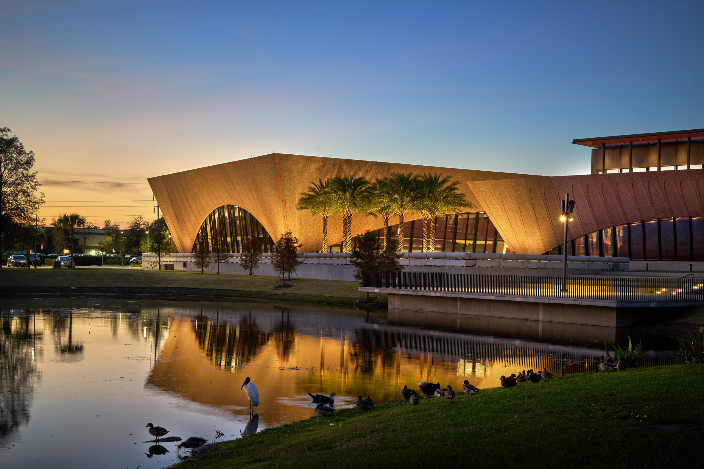 Image of Winter Park Library & Events Center by a lake