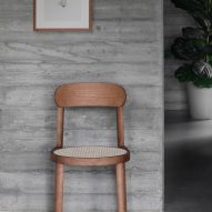 A photograph of the Brulla chair in stained walnut finish