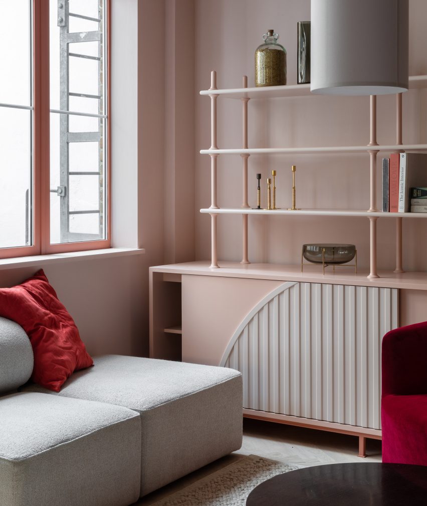 Baby pink co-working room with matching shelving by Holloway Li