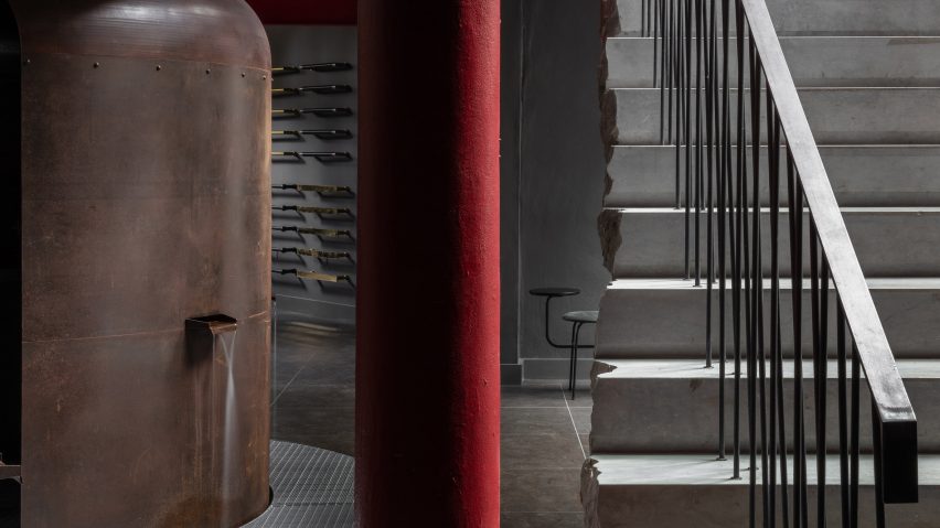 Boiler on ground floor of Coalbrook's London showroom next to a red column and limestone staircase