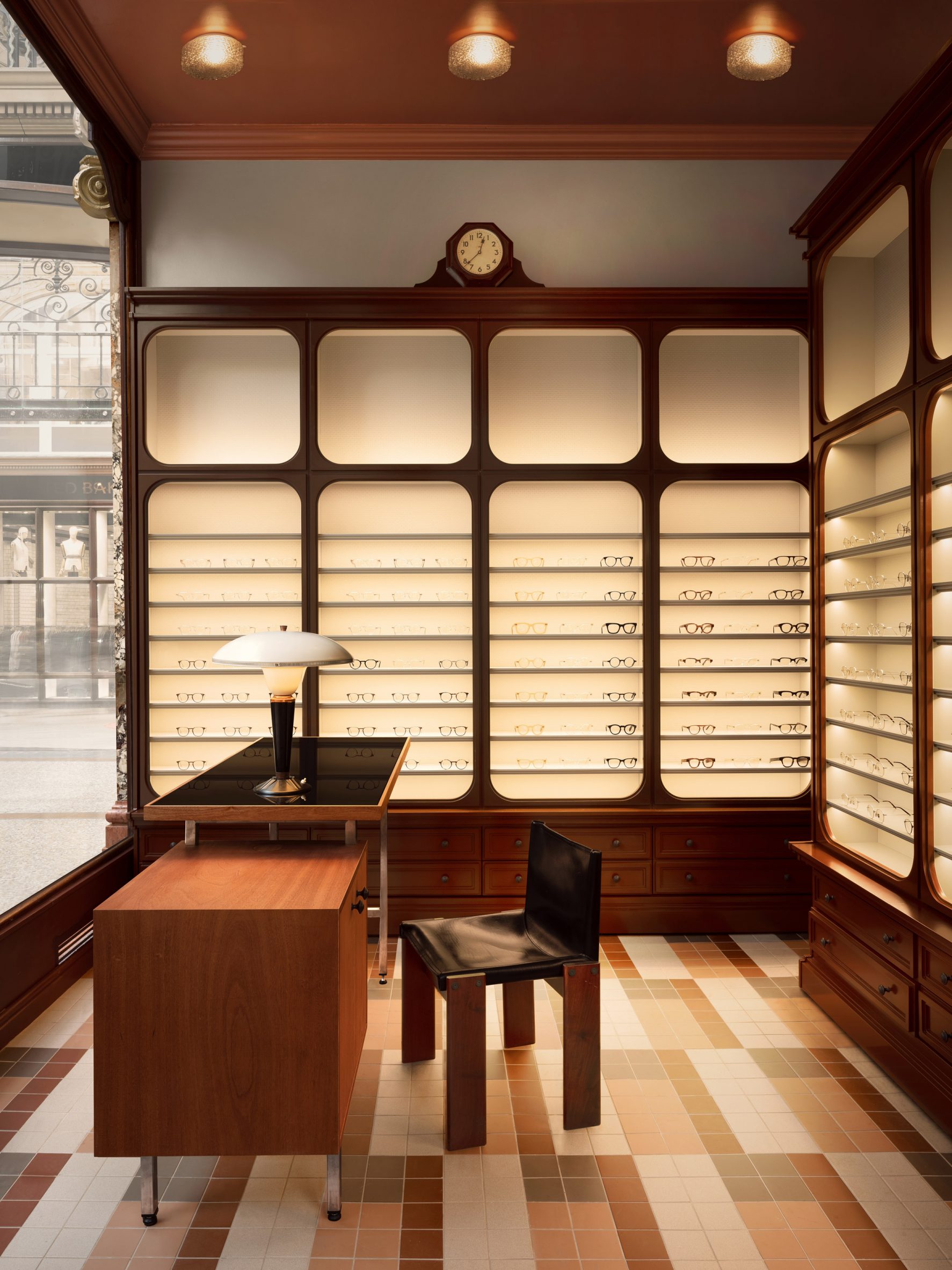 Leeds eyewear store by Child Studio with mosaik tile floor and wooden cabinetry