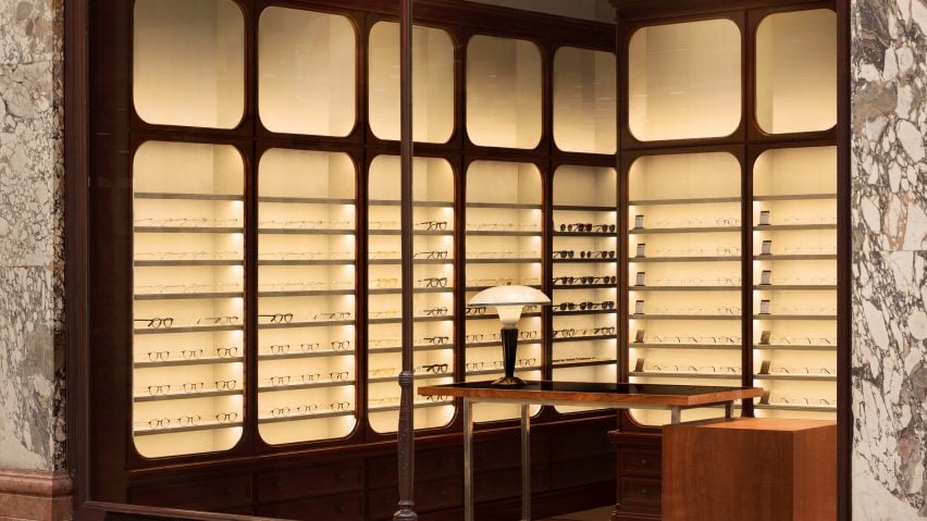 Glasses displayed on backlit Victorian-style shelves in Cubitts store in Leeds by Child Studio