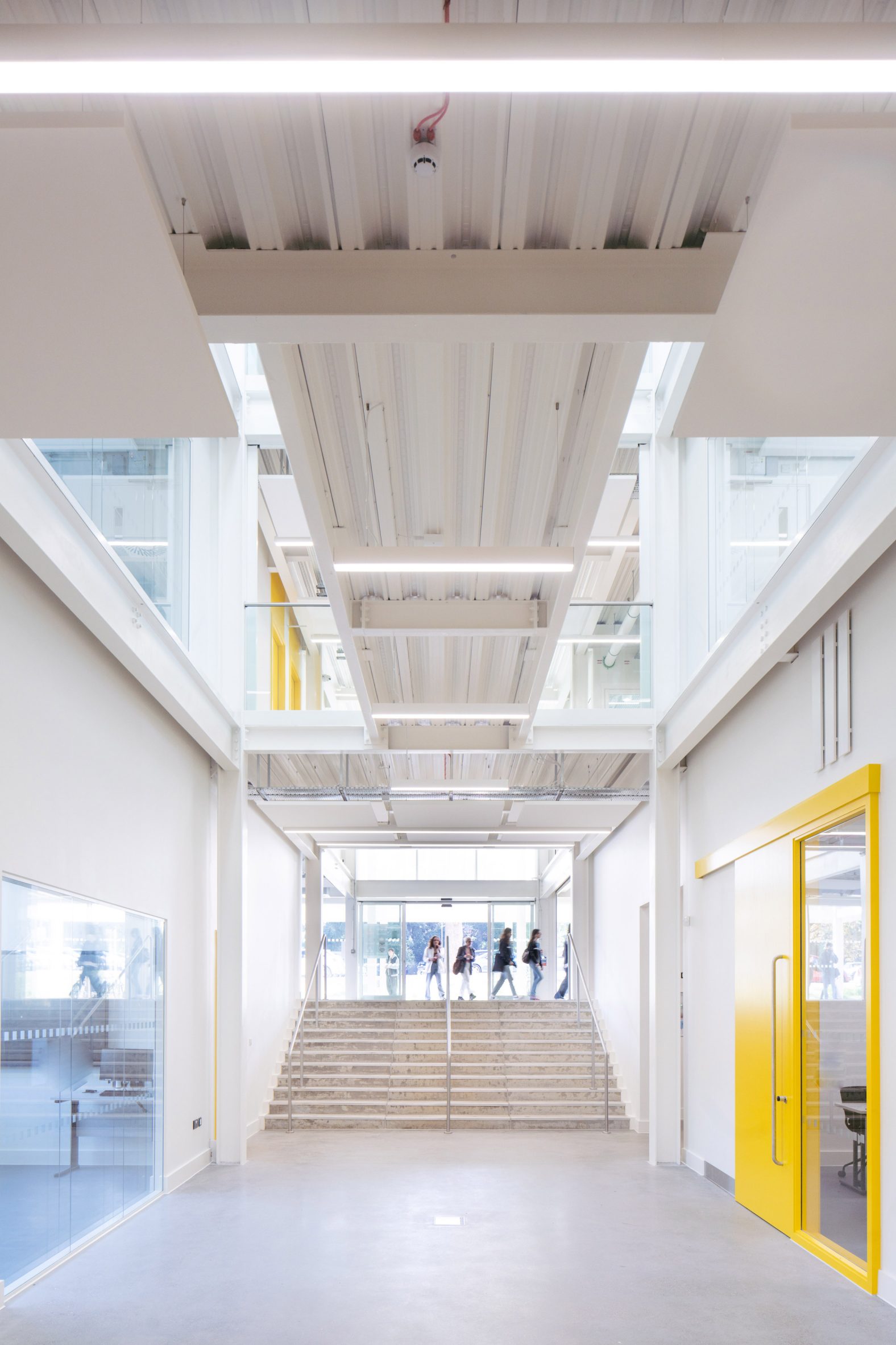 White corridor with exposed steel structure