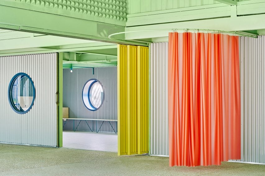 Coloured details including red curtain and yellow screen, Educan school for dogs, humans and other species