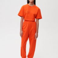 A model wearing Es Devlin's orange clothing for Pangaia